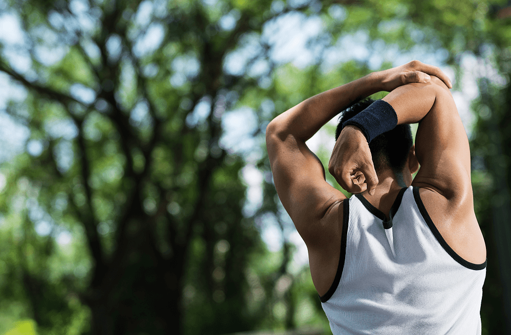 Male Runner Stretching Outdoors