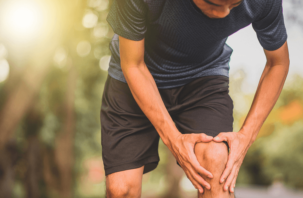 Man Suffering With Knee Pain When Bending