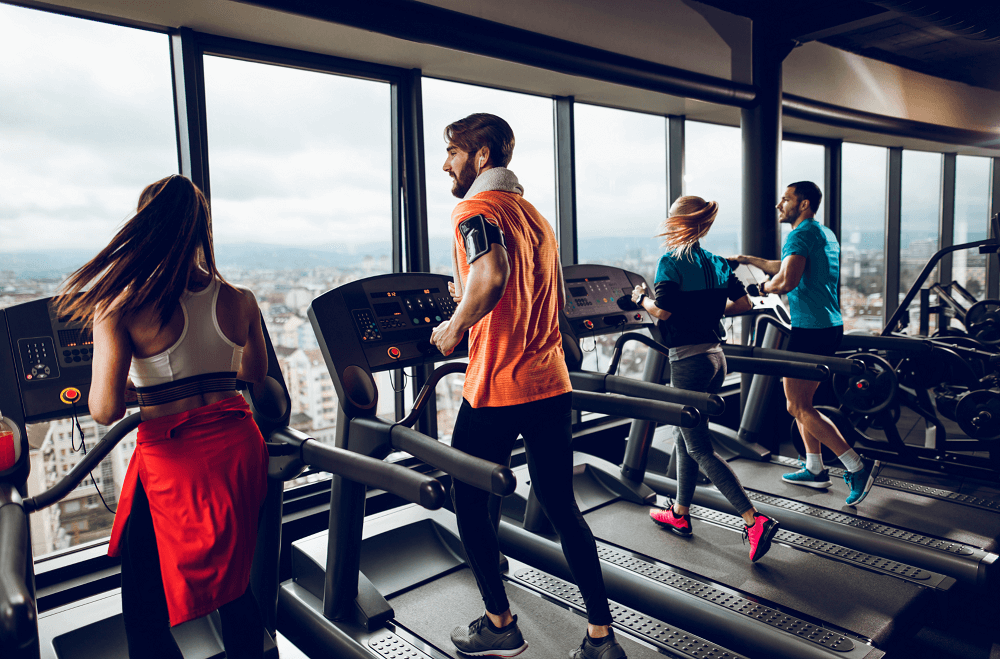 People Running On Treadmill In The Gym